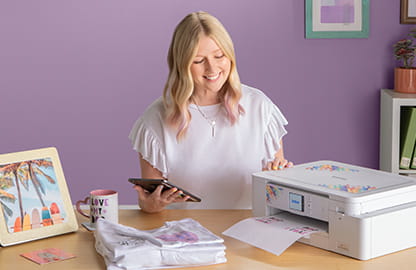 Image of a lady printing an image from her smart device to the Brother Sublimation SP1 printer