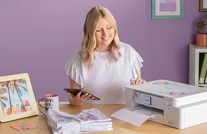 Image of a lady printing an image from her smart device to the Brother Sublimation SP1 printer