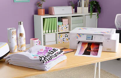 Image of T-Shirts that have been printed using the Brother Sublimation SP1 printer and an image being printed on the Sublimation SP1 printer