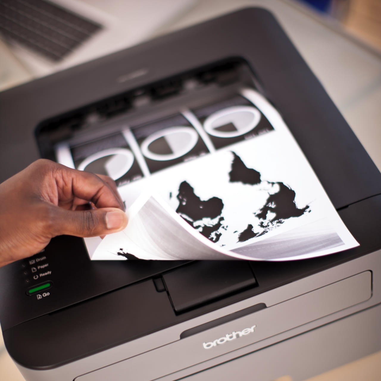 Brother HL-L2300D printer printing a page