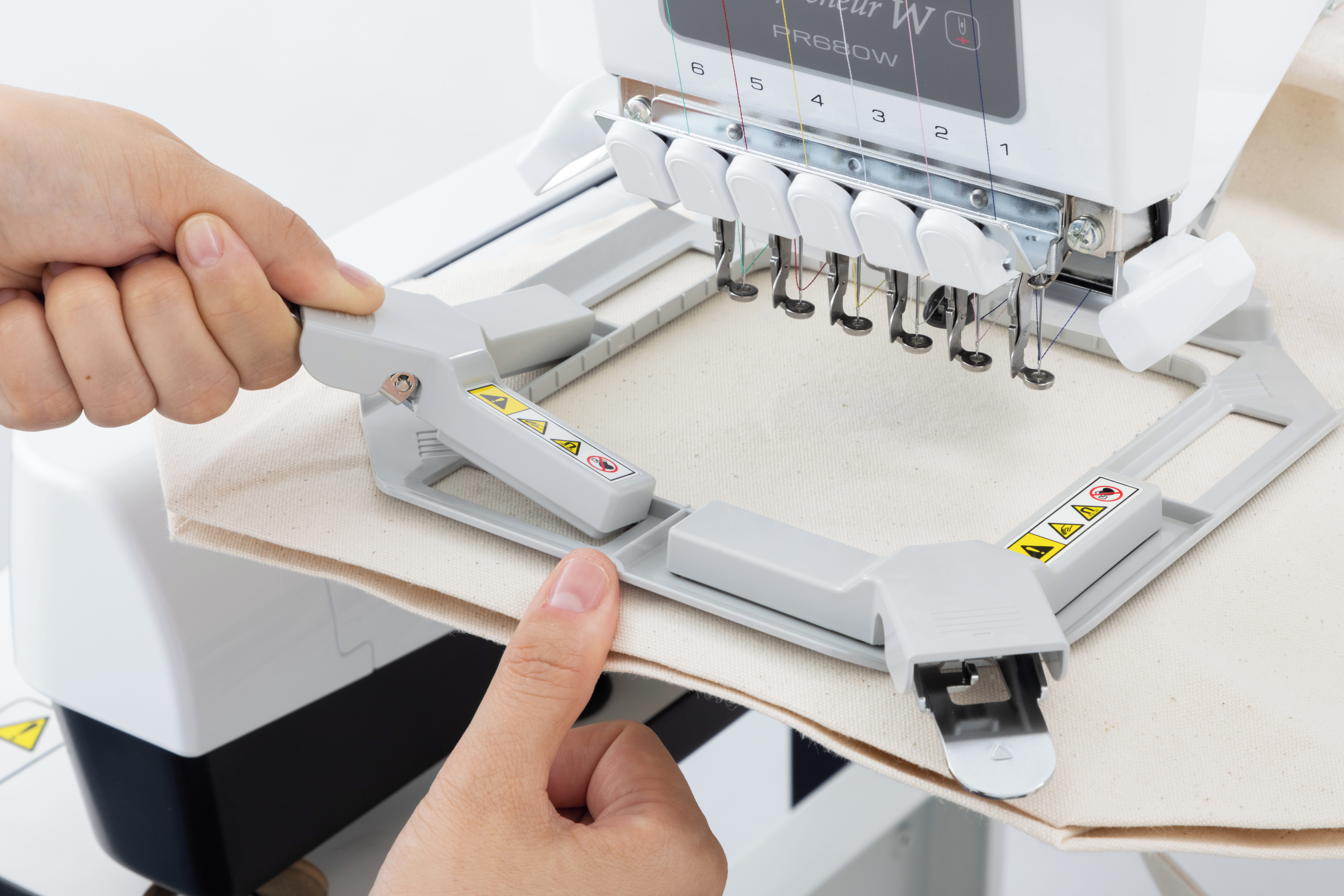 Image of a person applying magnets to the Versatile Magnetic Frame PRVMFLAP