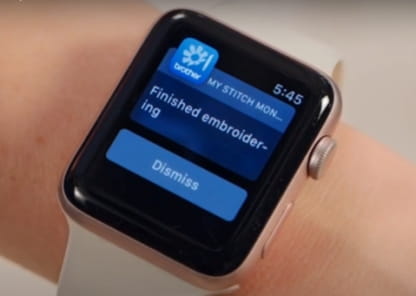 Image of a smart watch monitoring the Brother machine