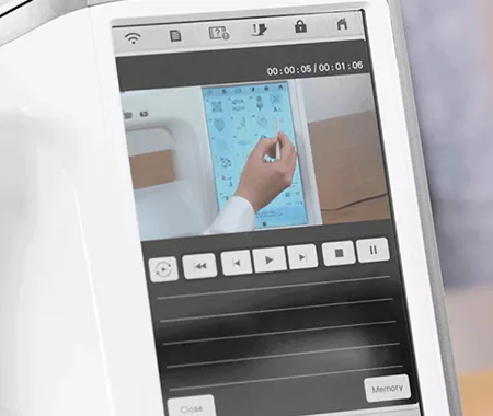 Image of the Brother Stellaire2 Innov-is XE2 Embroidery machine screen displaying a built-in tutorial playing on the machine screen