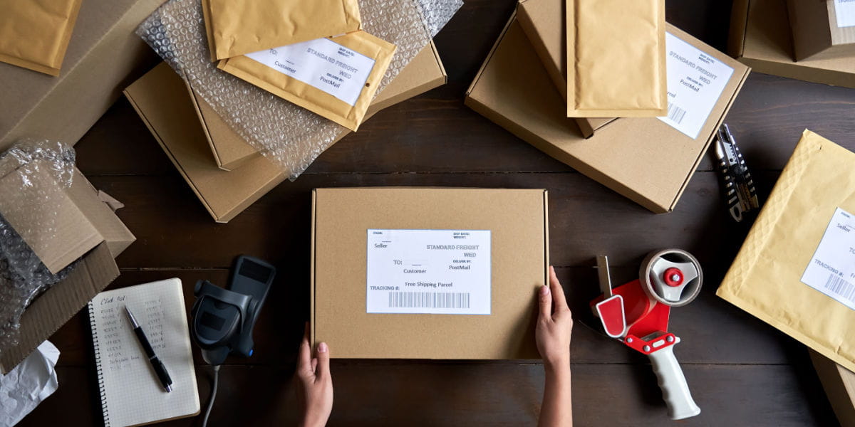 Parcels and packages on a desk with shipping labels