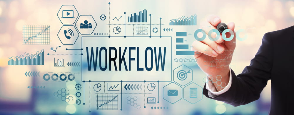 Workflow diagram of digital technology with man pointing pen at screen