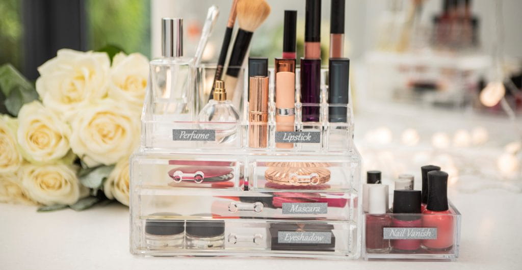 Bathroom makeup boxes with labels attached.