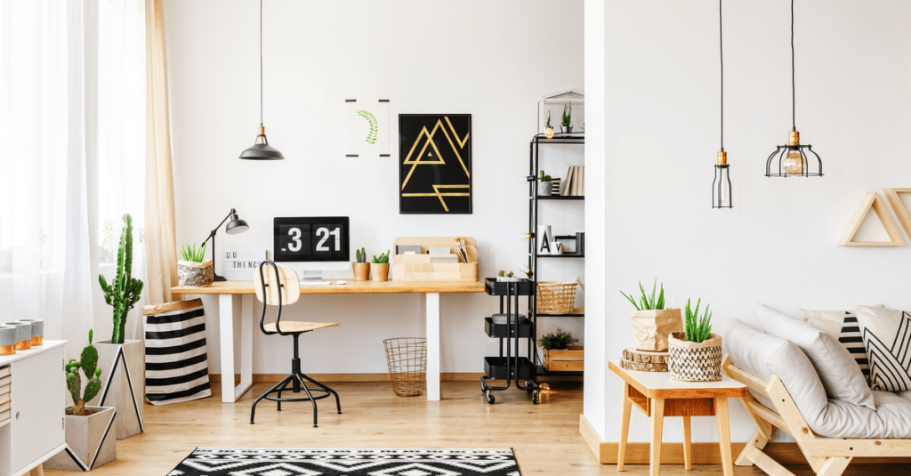 A Scandinavian home office design with natural light and art deco ceiling lights.