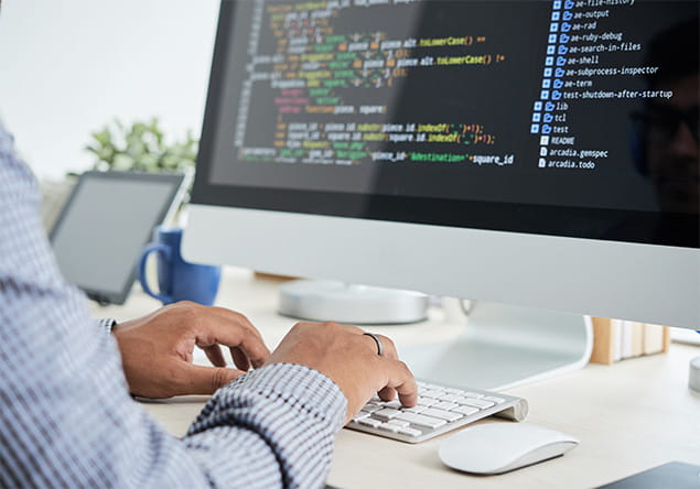 Person coding on a computer