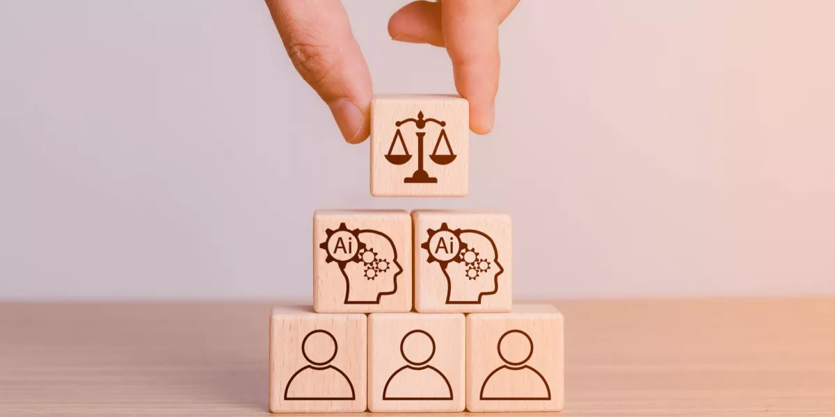 Hand holding ai and human icons on cubes depicting benefits of ai