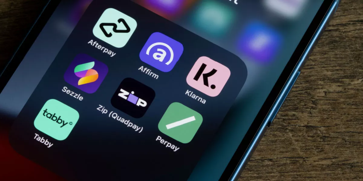 A range of buy now, pay later apps displayed on a smartphone screen
