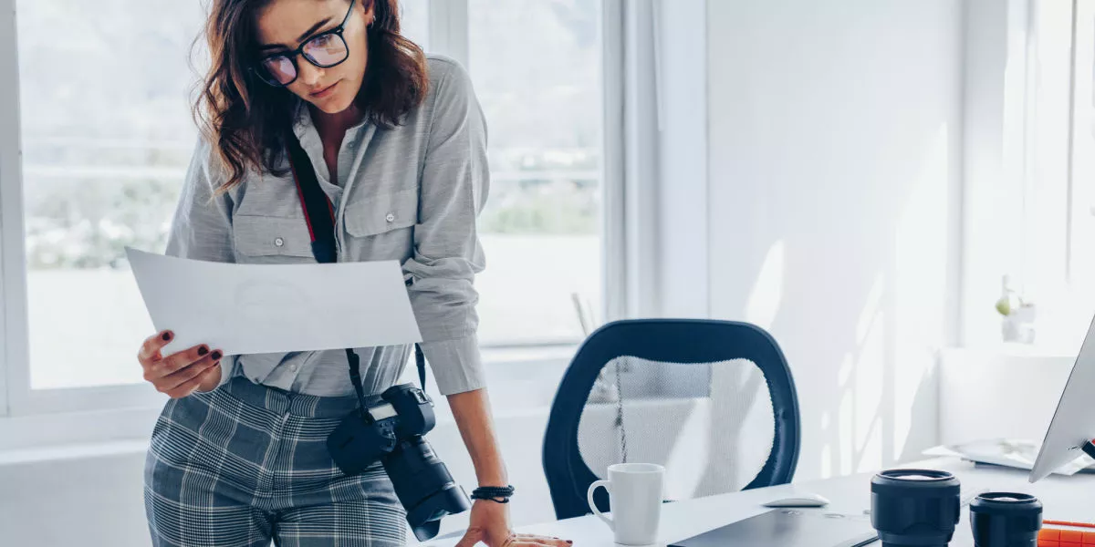 Lady looking at a document in a professional environment