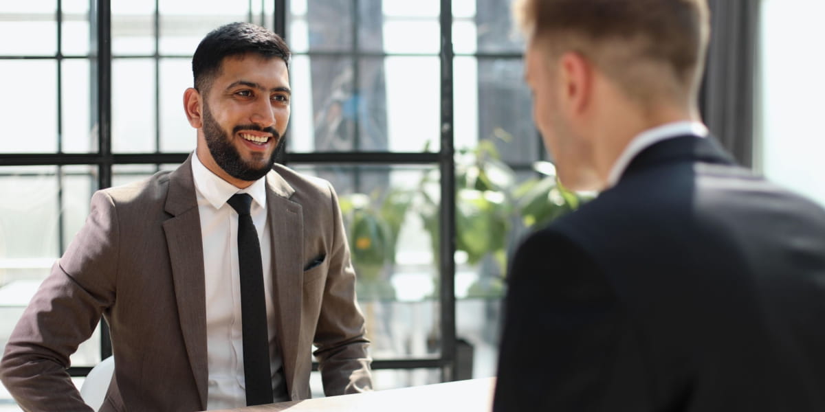A small business owner having a meeting with a partner in an office