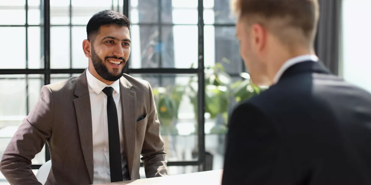 A small business owner having a meeting with a partner in an office