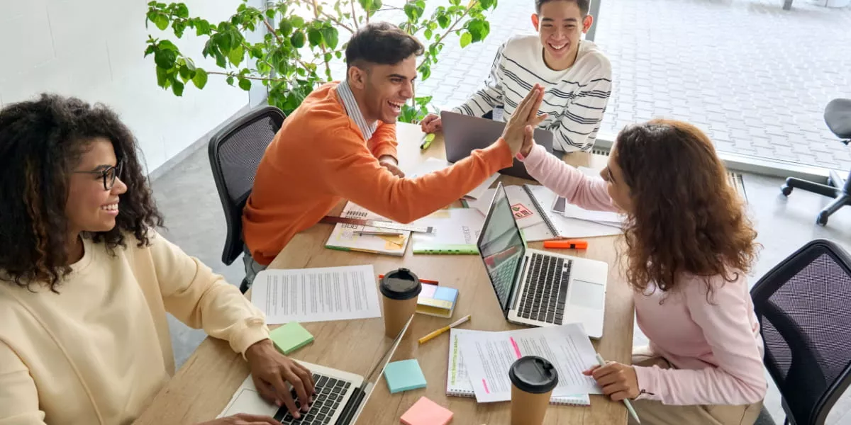 Team members in an office collaborating during a meeting
