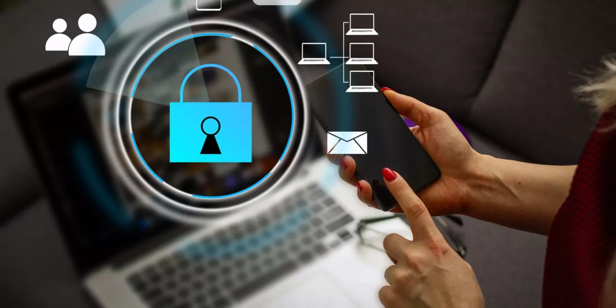 A laptop screen with digital security icons and a hand pointing at them