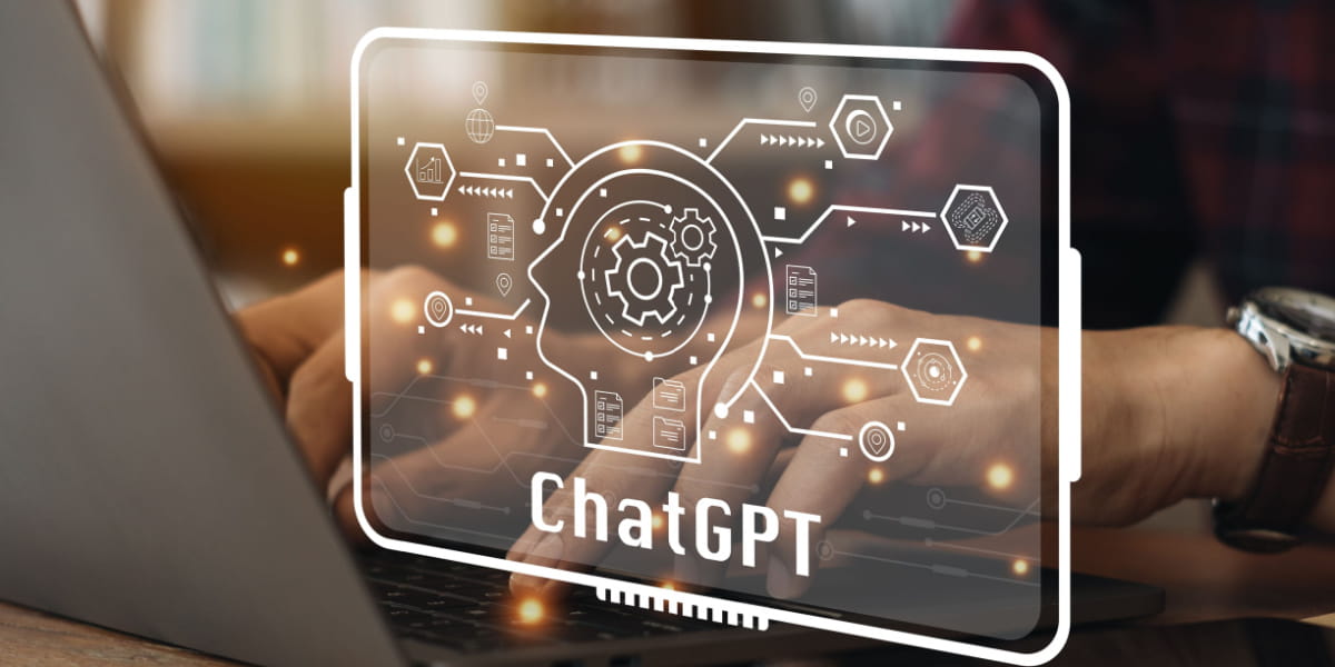 ChatGPT overlay with man typing on laptop in background