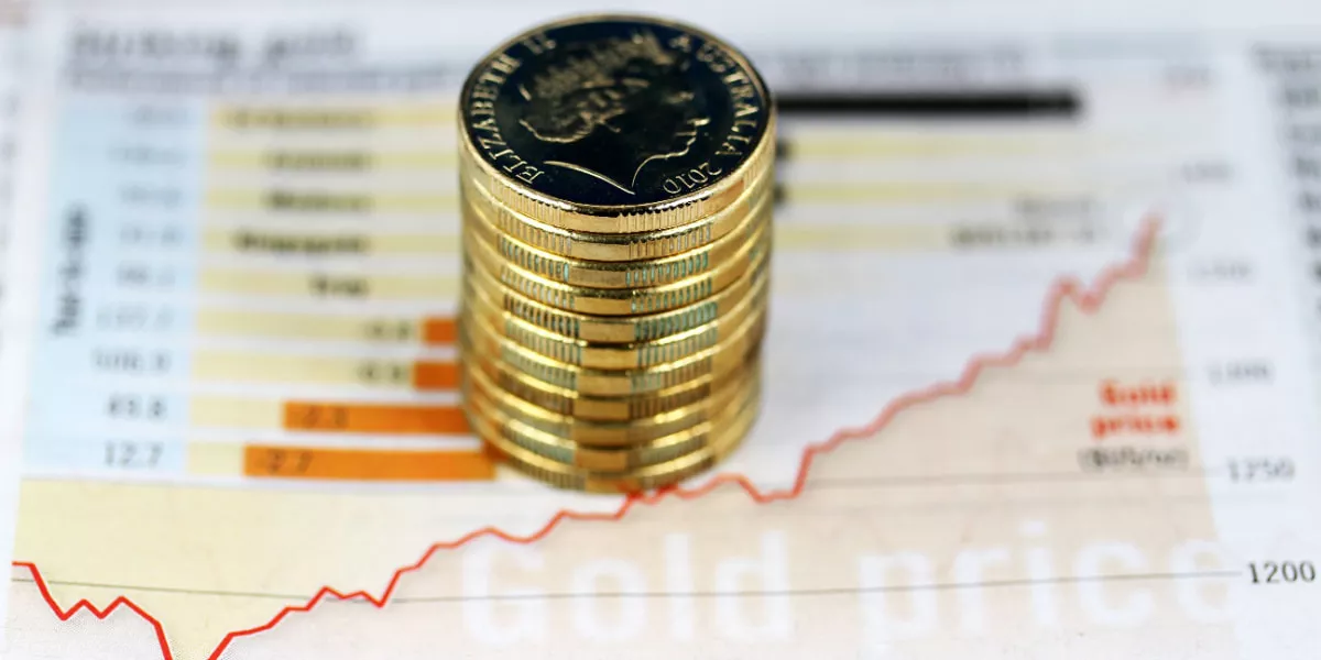 Australian gold coins on a graph depicting higher profits