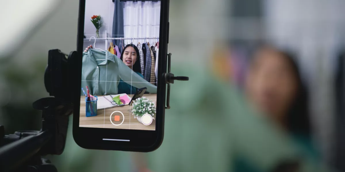 A business owner recording a video for social media to sell products online