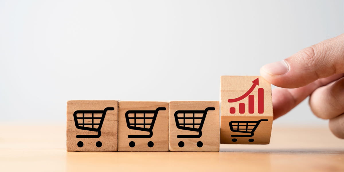 Shopping cart icons with a graph displaying an upward arrow