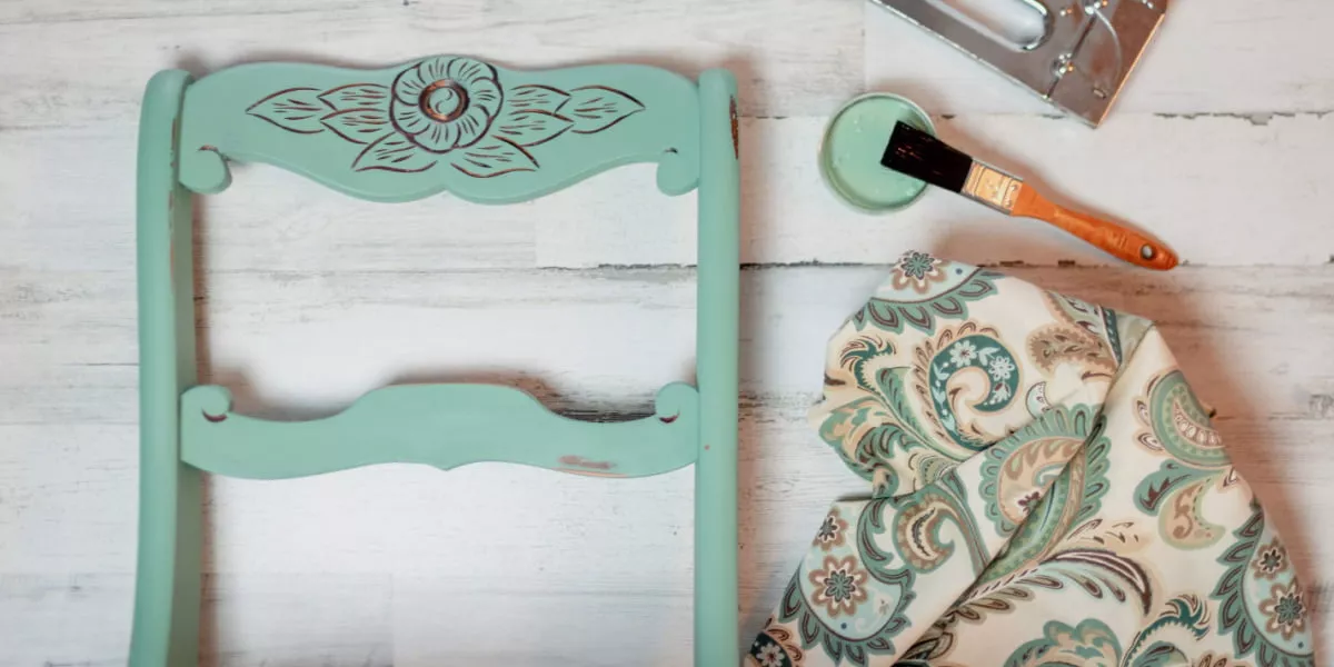 A green upcycled wooden office chair