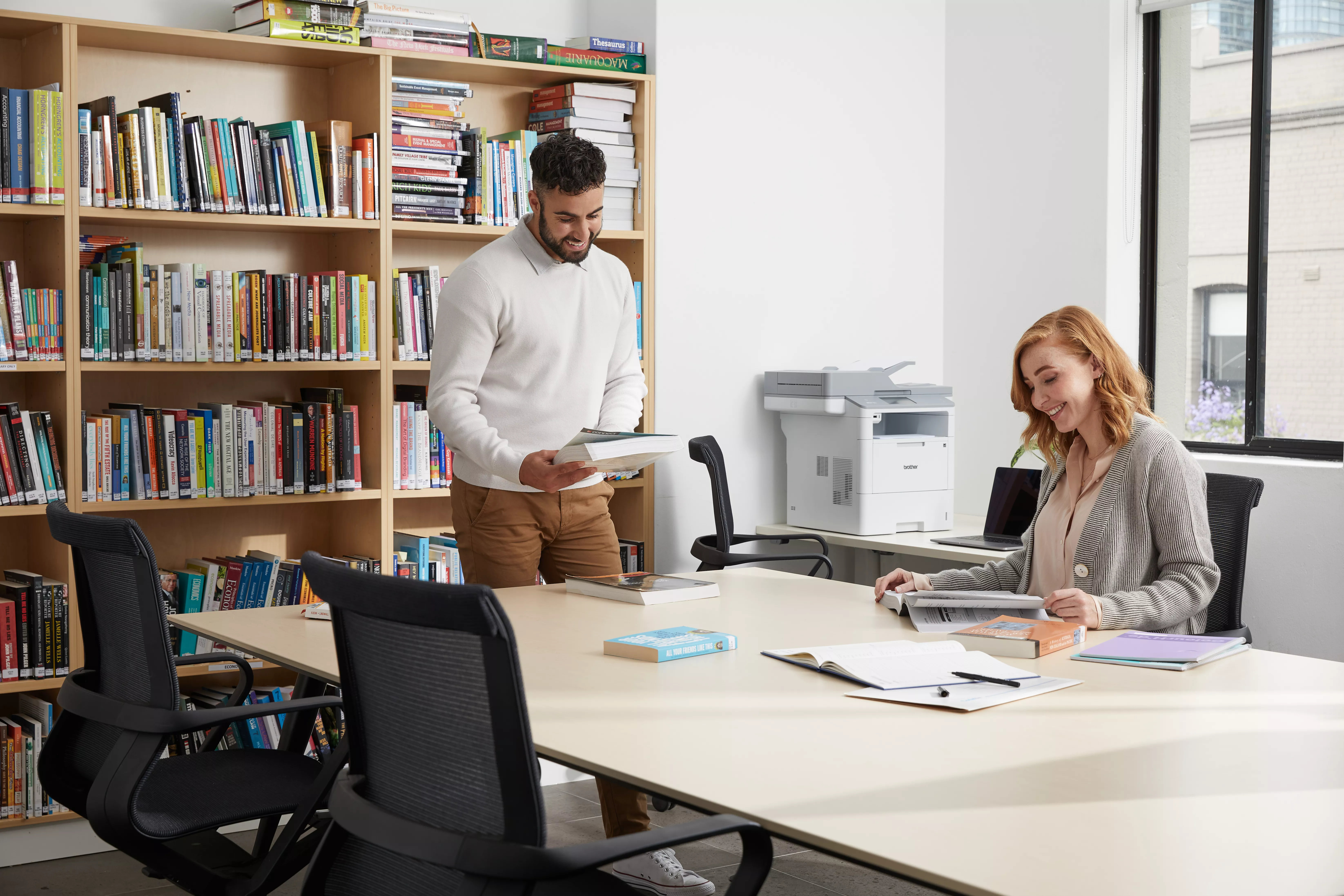 printer and teachers in a library