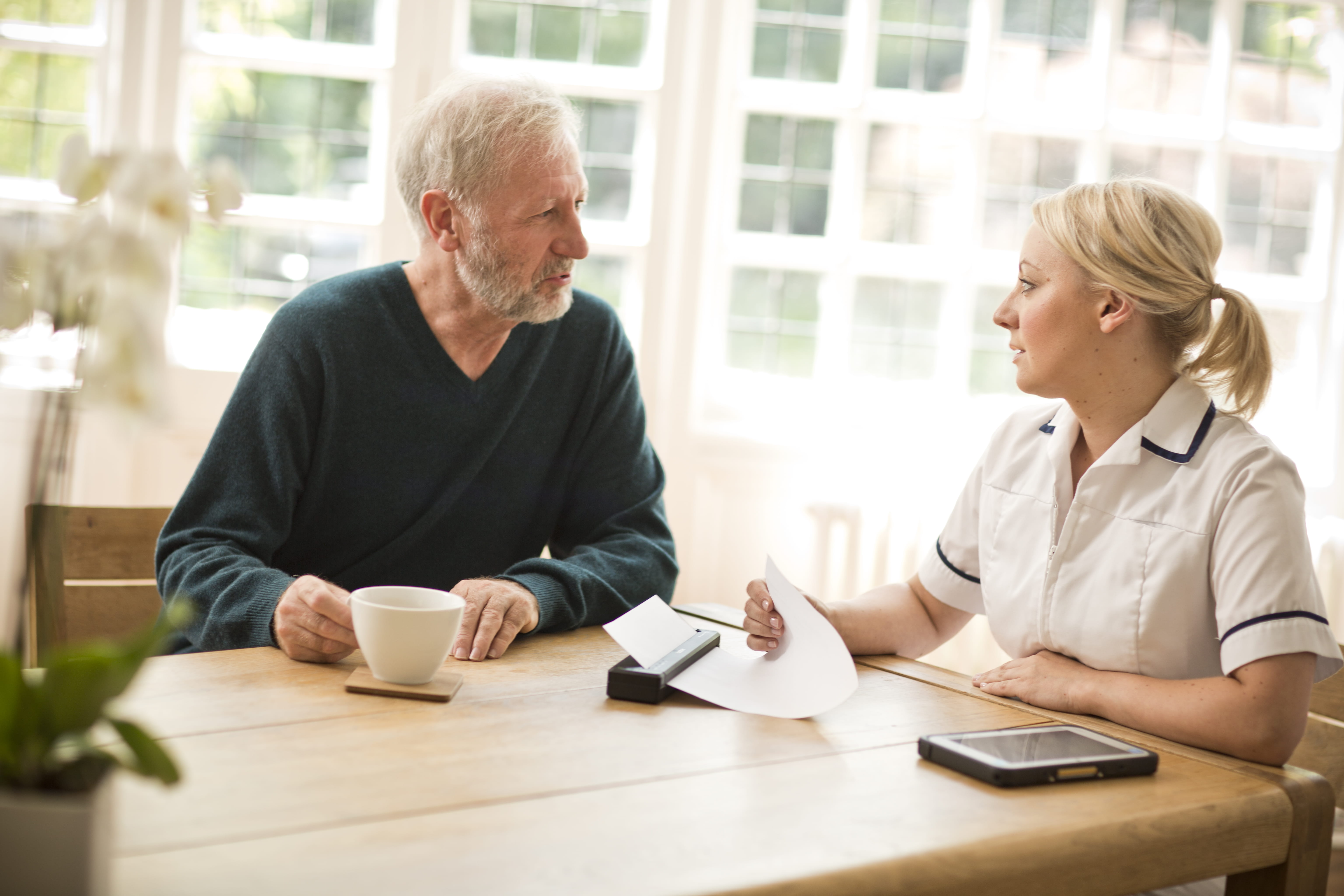 Community nurse talking to resident