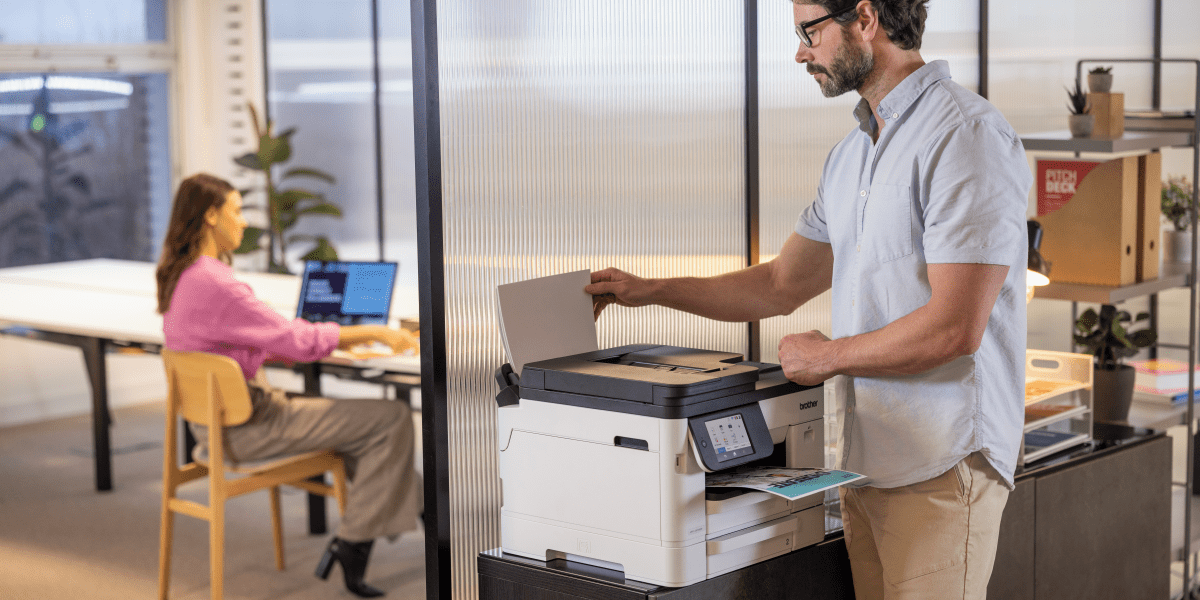 man printing documents