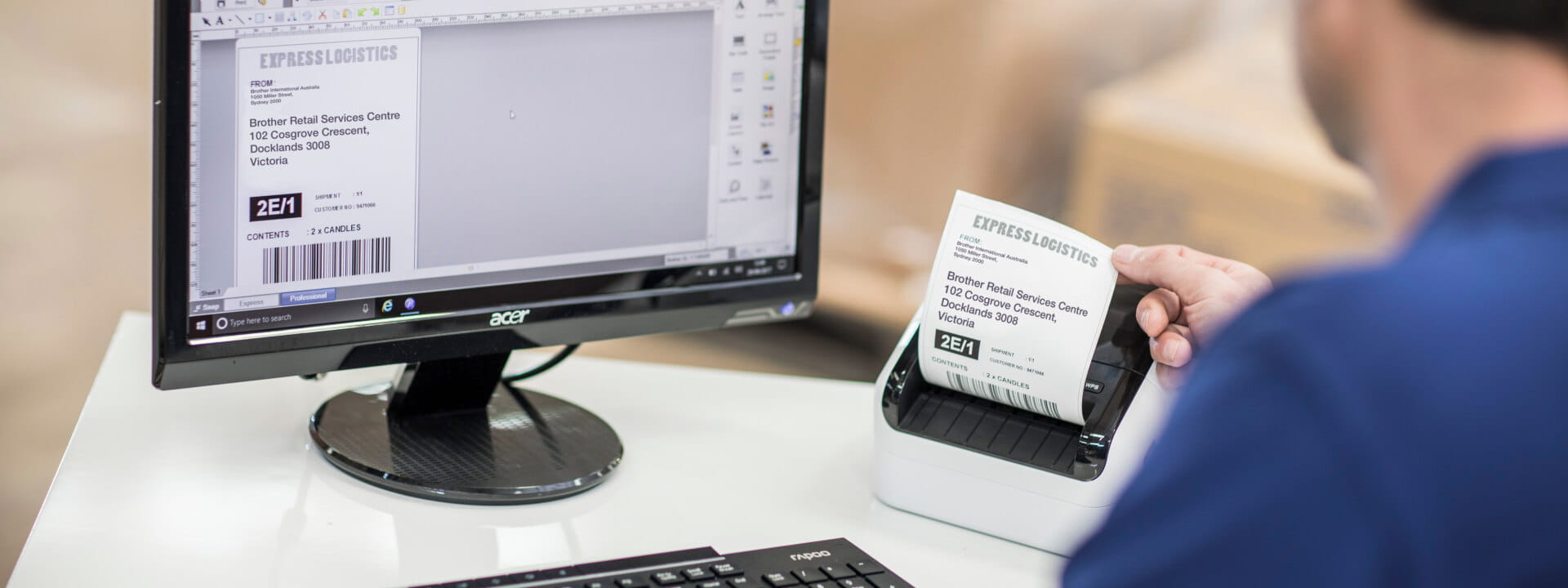 Warehouse employee printing shipping labels