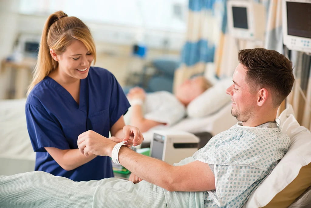 nurse-fixing-tag-on-patient-small