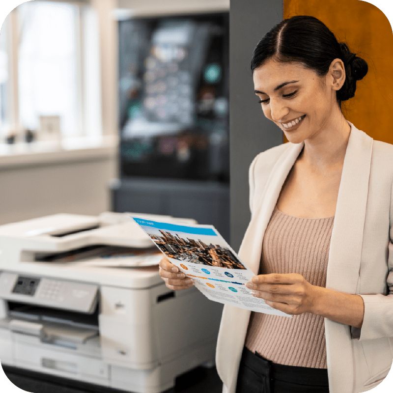 woman looking at printed document