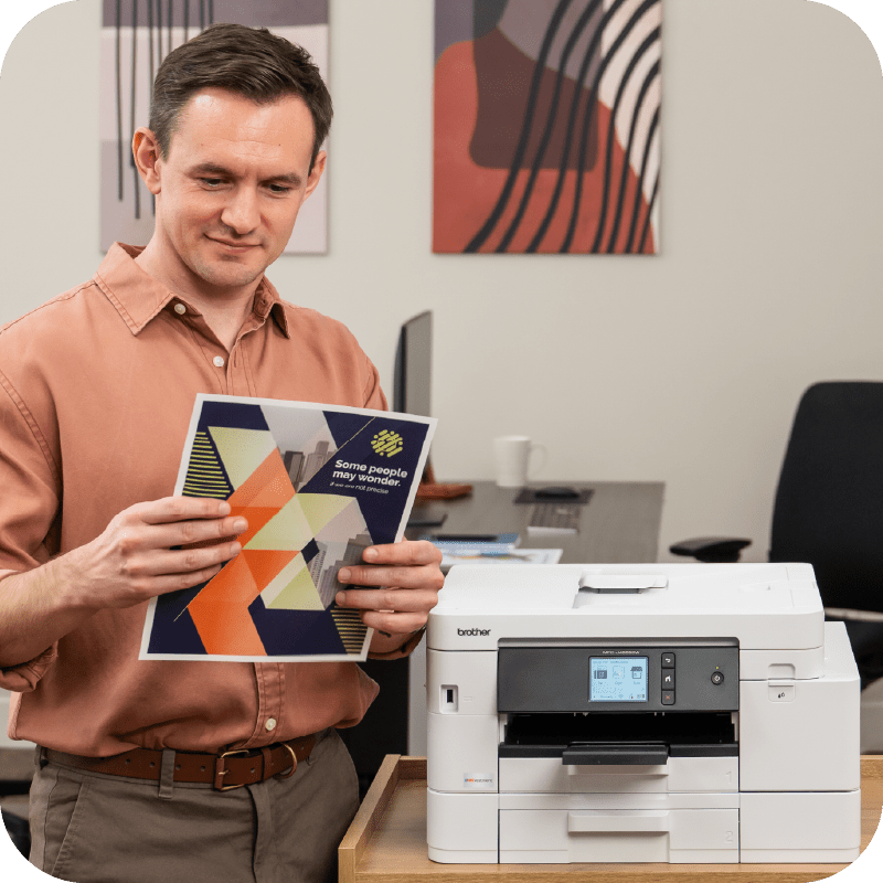 man looking at his printed document