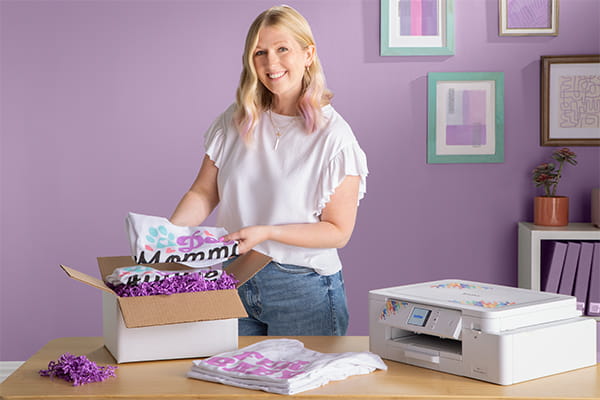 woman packing printed t-shirts