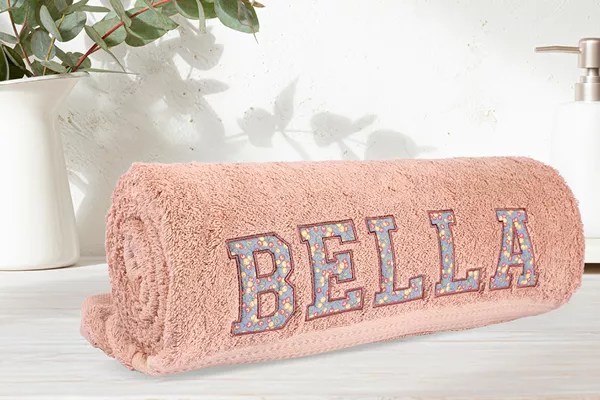Image of a towel with applique fabric letters