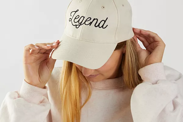 image of a person wearing an machine embroidered cap