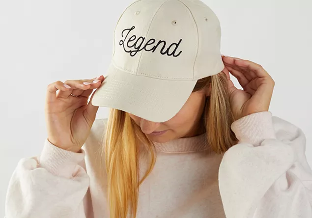 image of a person wearing an machine embroidered cap