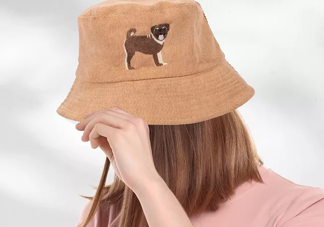 Image of a person wearing a hat with an embroidery design