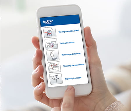 Image of a person accessing the Brother support app page for basic sewing machine operation.