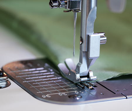 Image of the exclusive Brother pin feed mechanism on the PQ1600S high speed straight stitch sewing machine