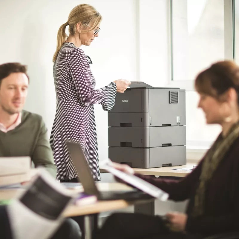 mono laser printer hl-l5200dw on desk with optional trays