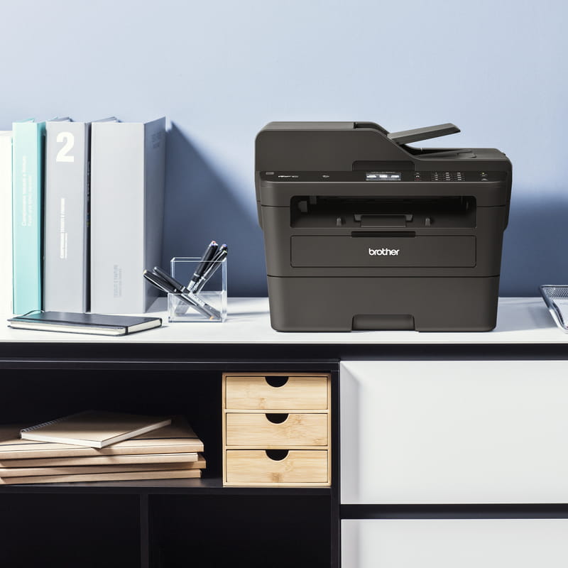 mono laser printer mfc-l2750dw on desk