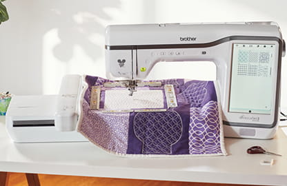 Image of the Brother Stellaire2 Innov-is XE2 embroidery machine with an embroidered quilt hooped with the magnetic frame