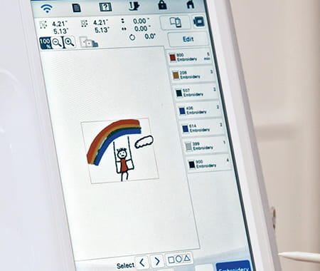 Image of the Brother Stellaire Innov-is XE2 screen depicting a hand drawn image of a rainbow and child on a swing that has been converted to embroidery