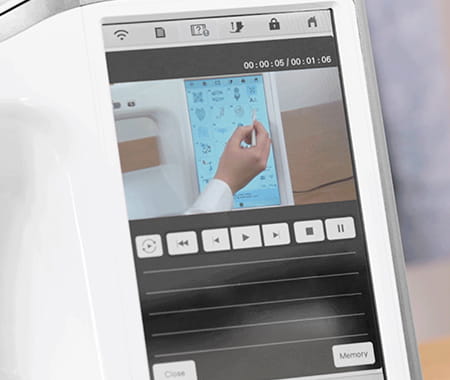 Image of the Brother Stellaire2 Innov-is XE2 Embroidery machine screen displaying a built-in tutorial playing on the machine screen