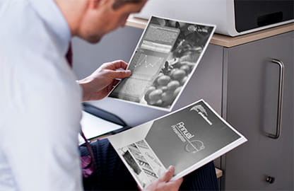 man looking at printed documents