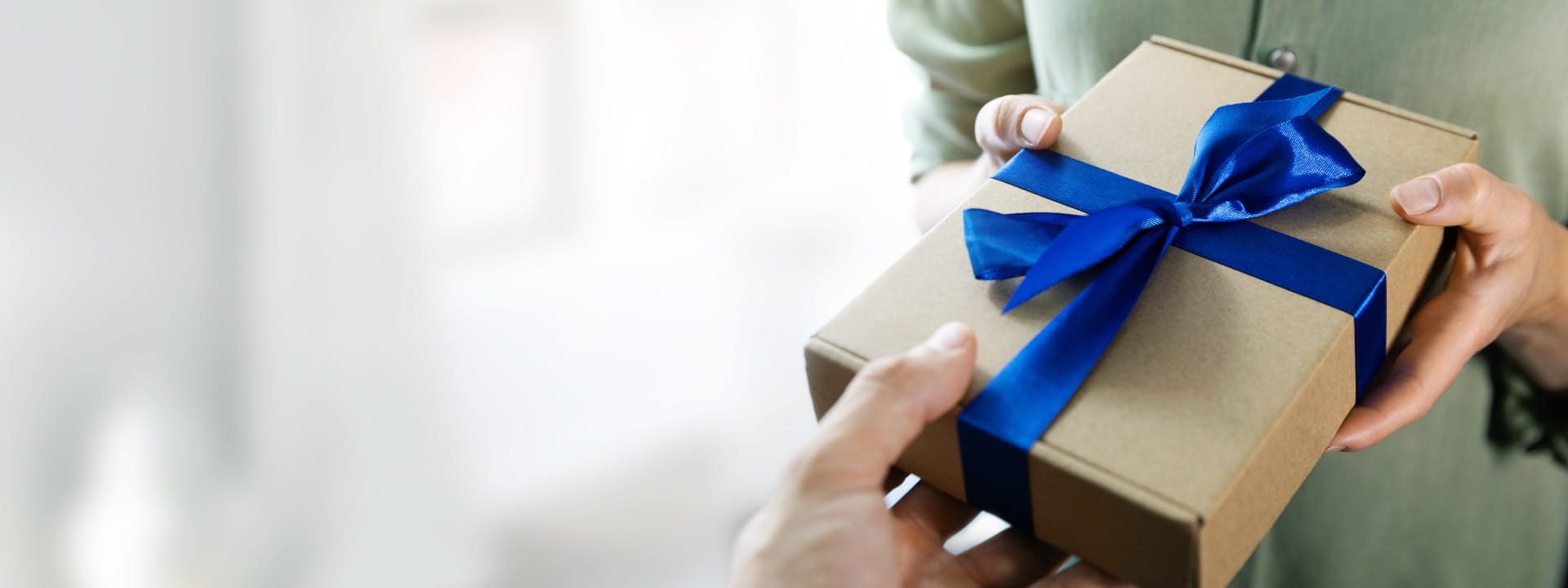 Giftbox with blue ribbon bow