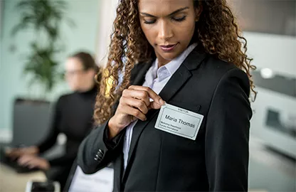 woman wearing a name label