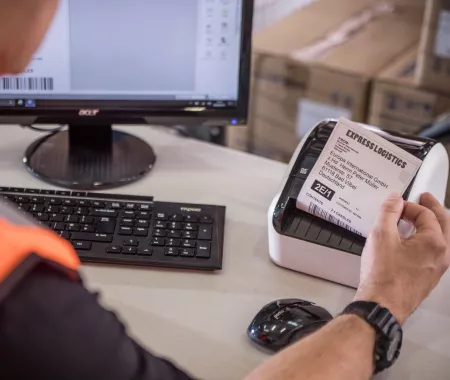 man printing labels