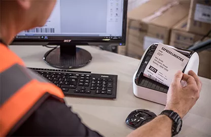 man printing labels