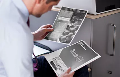 man looking at printed documents