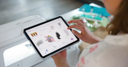 Image of a person interacting with a smart device and the Brother Artspira App